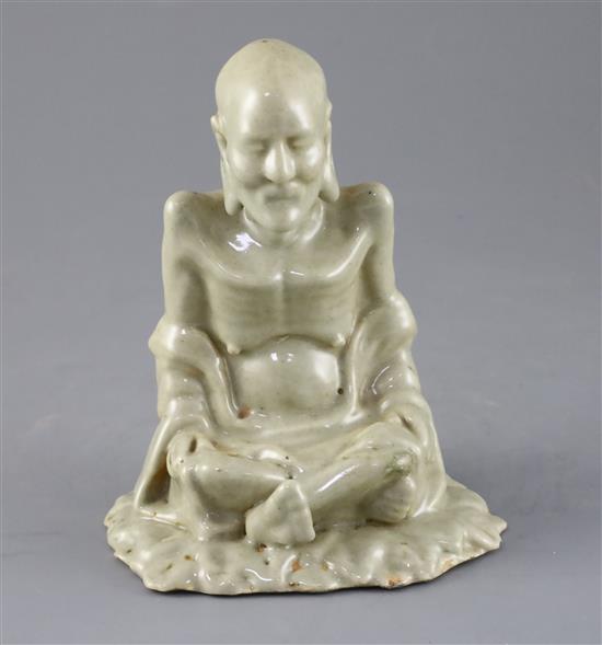 A Chinese celadon glazed figure of Laozi, 18th / 19th century, H.15.5cm, small area of restoration to left knee